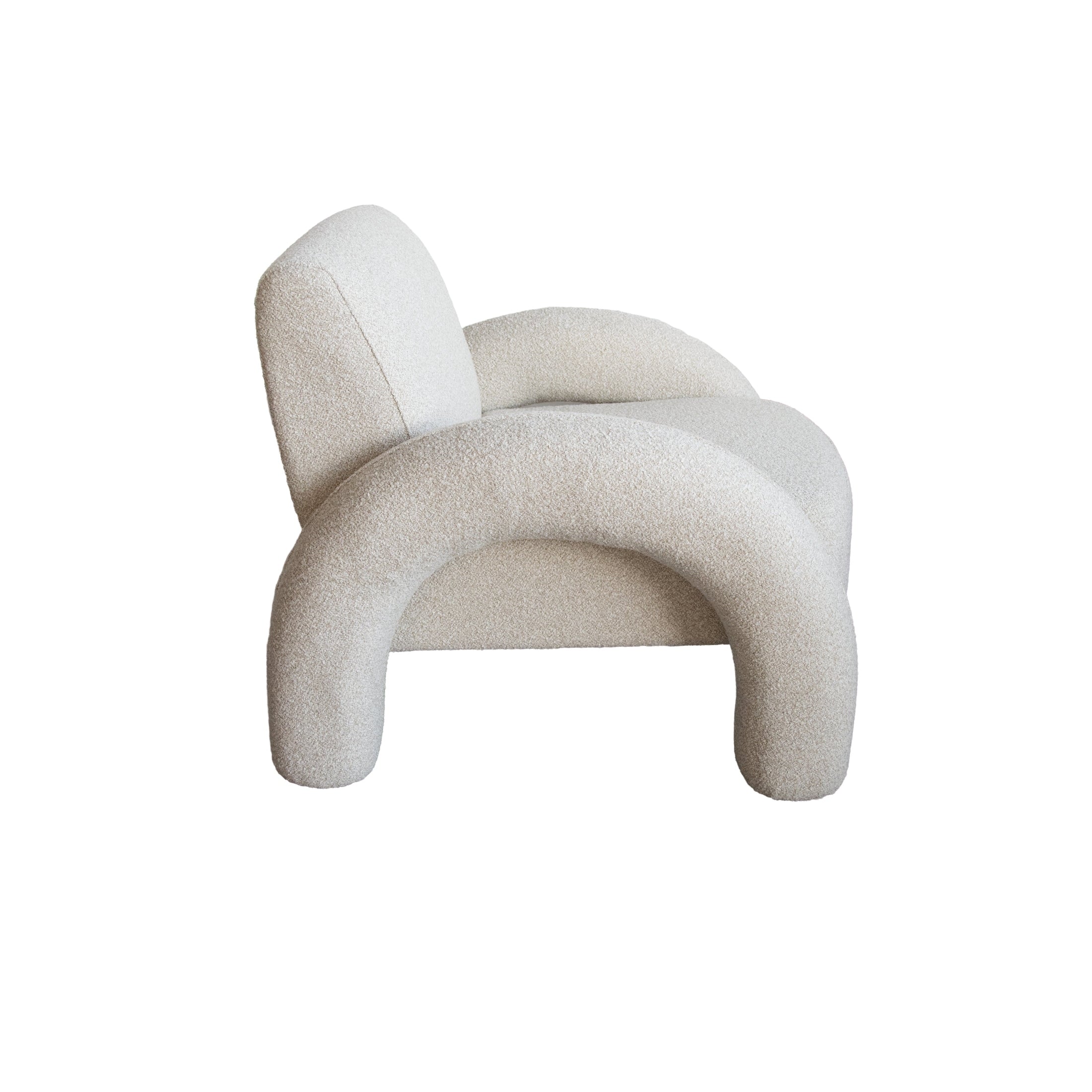 Front view of the Alva Accent Chair in cream bouclé with distinctive oversized tubular legs and a sculptural silhouette