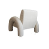 Low-angle rear view emphasizing the oversized proportions of the arched leg supports