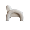 Side perspective demonstrating the bold arched shape of the tubular frame and low-slung seating