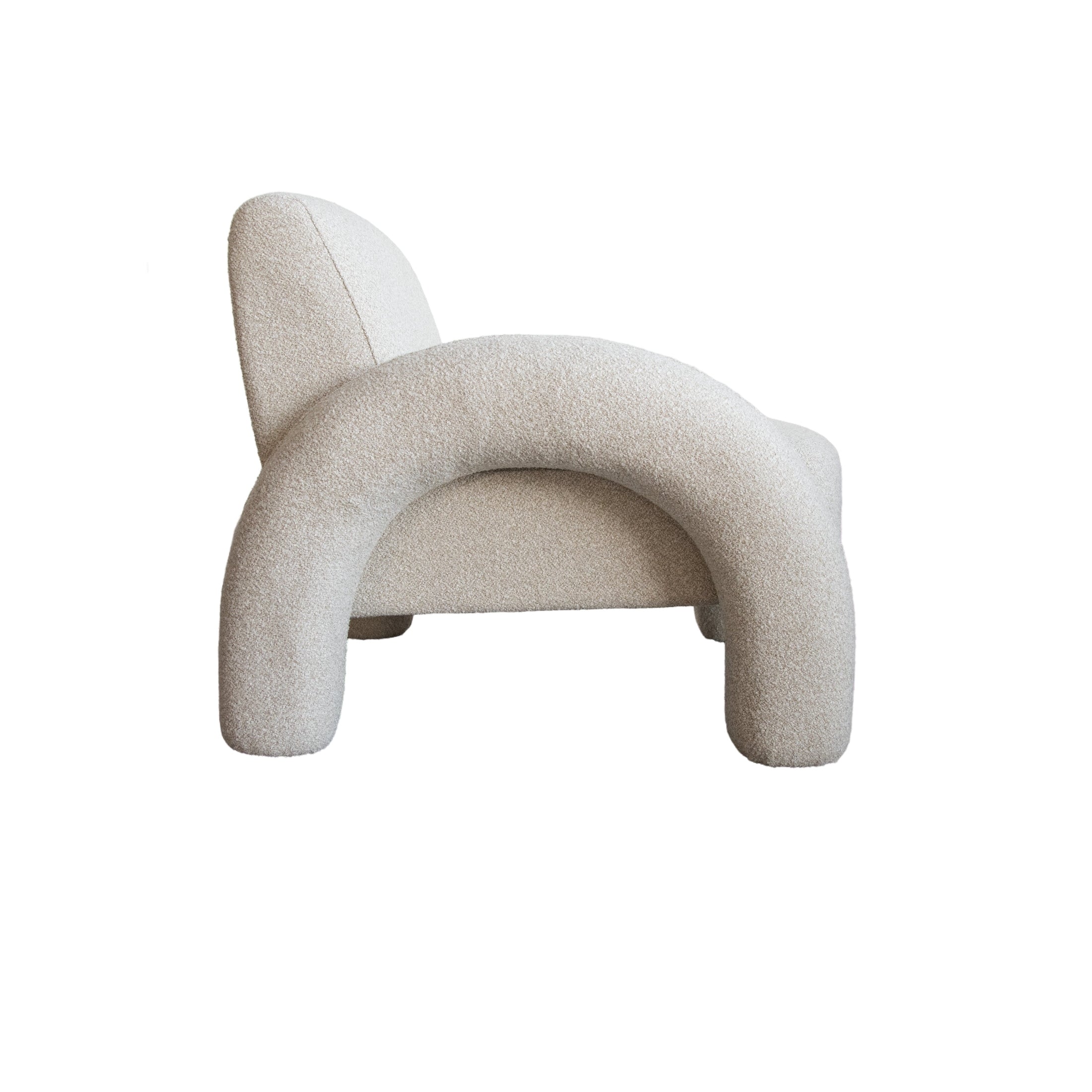 Front view of the Alva Accent Chair in cream bouclé with distinctive oversized tubular legs and a sculptural silhouette