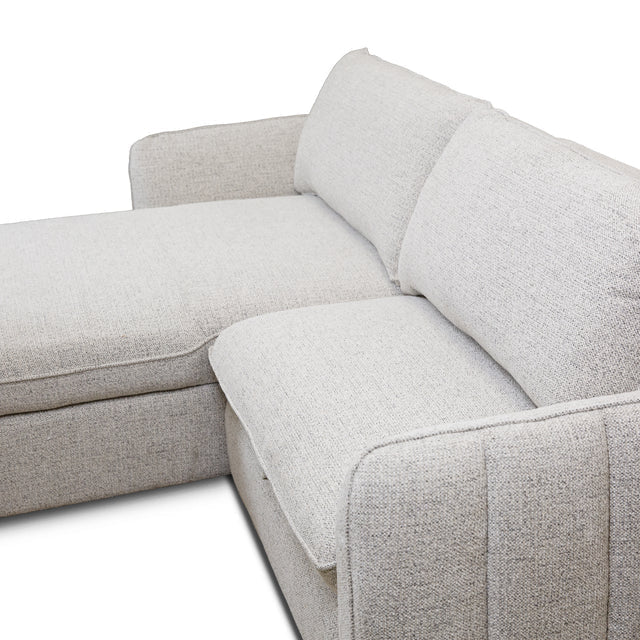 Front view of the Amira Pullout Sleeper Sectional in light grey textured fabric with a right-facing chaise.