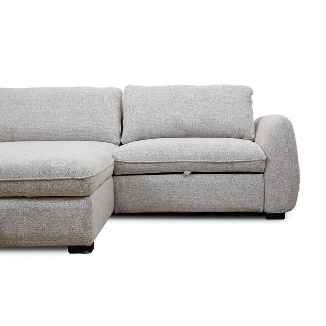 Front view of the Amira Pullout Sleeper Sectional in light grey textured fabric with a right-facing chaise.