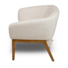 Side profile of the Annika chair showing the elegant slope of the armrests and the warm wood frame.