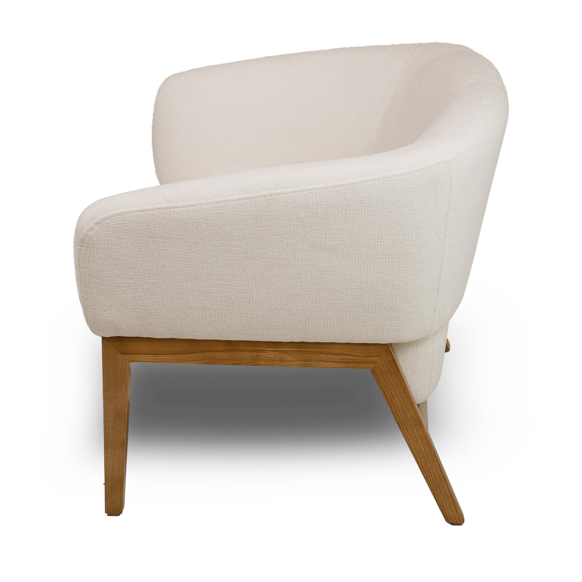 Front view of the Annika Accent Chair in Joyce Ivory textured fabric with a tapered oak wood base.