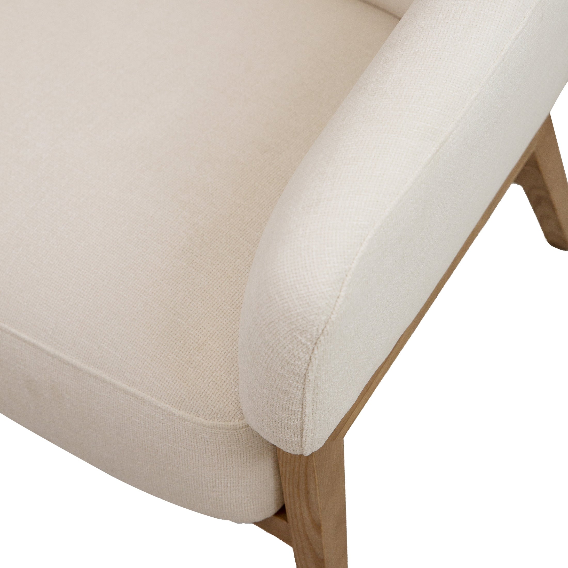 Front view of the Annika Accent Chair in Joyce Ivory textured fabric with a tapered oak wood base.