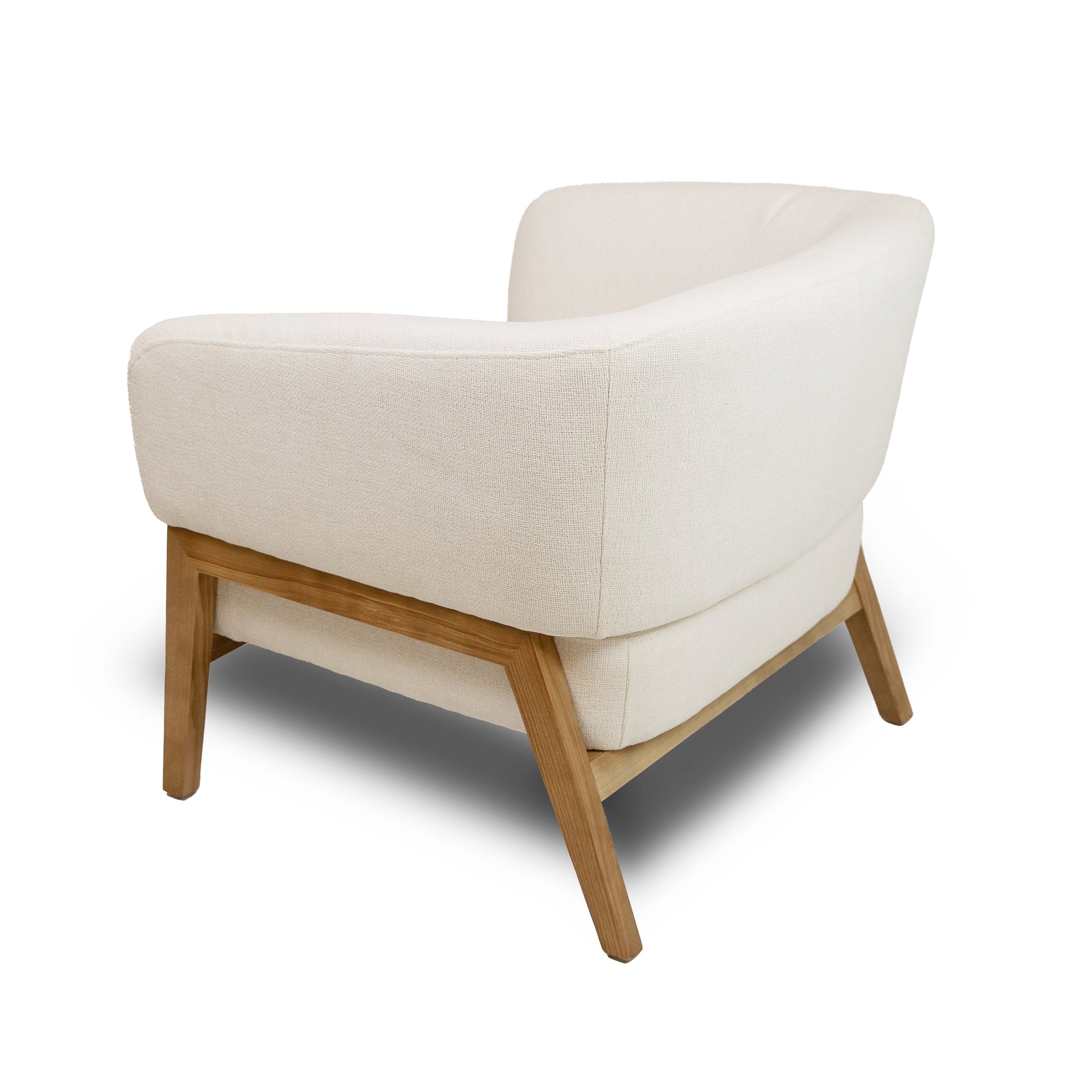 Front view of the Annika Accent Chair in Joyce Ivory textured fabric with a tapered oak wood base.