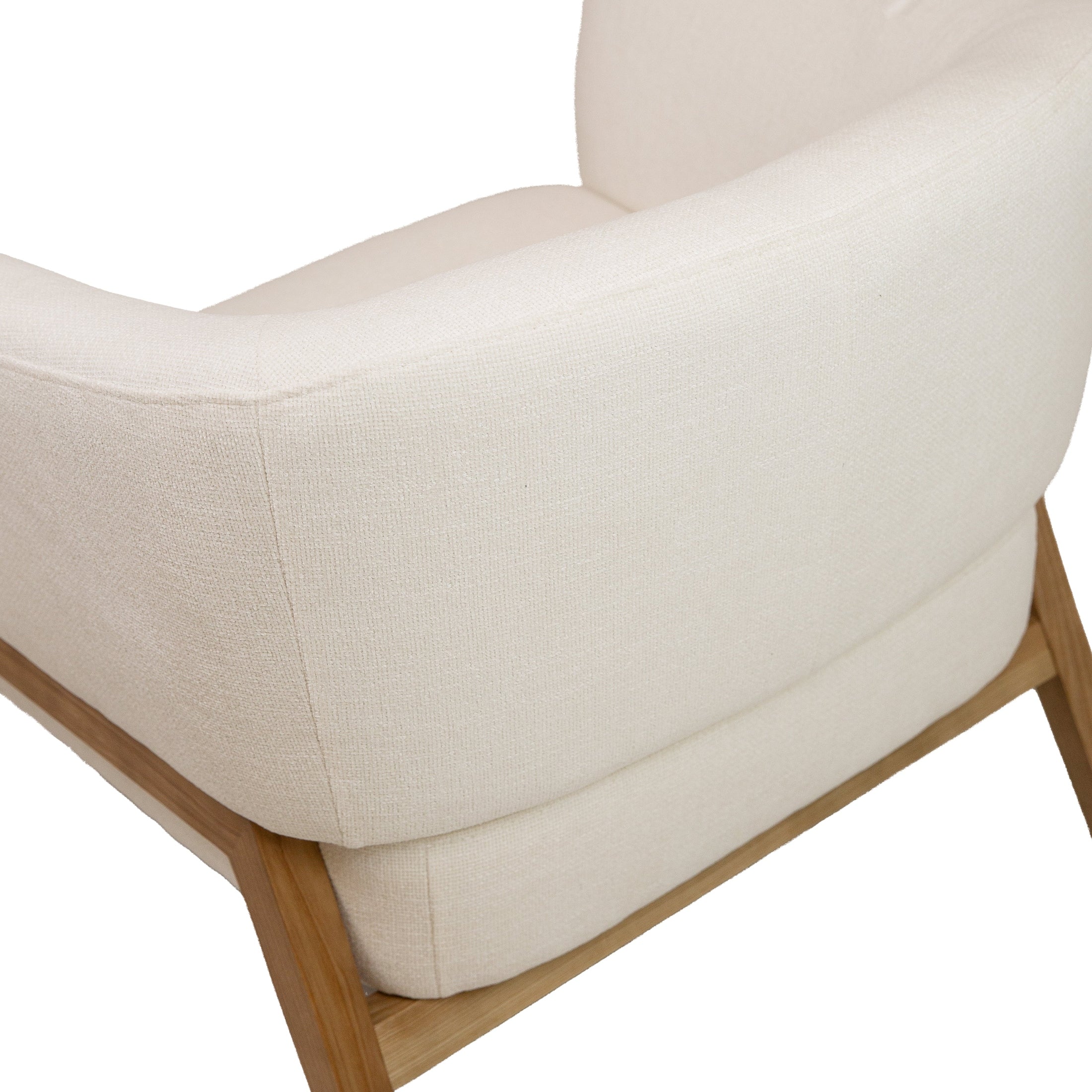 Front view of the Annika Accent Chair in Joyce Ivory textured fabric with a tapered oak wood base.