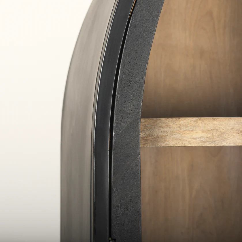 Straight-on front view of the Sloan arch cabinet featuring a matte black finish and natural wood interior shelves