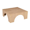 Front perspective view of the Archimedes square cocktail table featuring a low profile and four deep architectural arches crafted from light natural oak