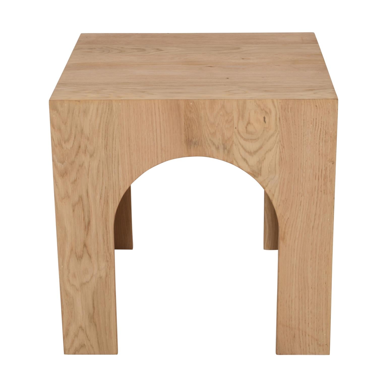Front view of the Archimedes end table featuring a square top and a unique sculptural base with deep architectural arches crafted from light natural oak