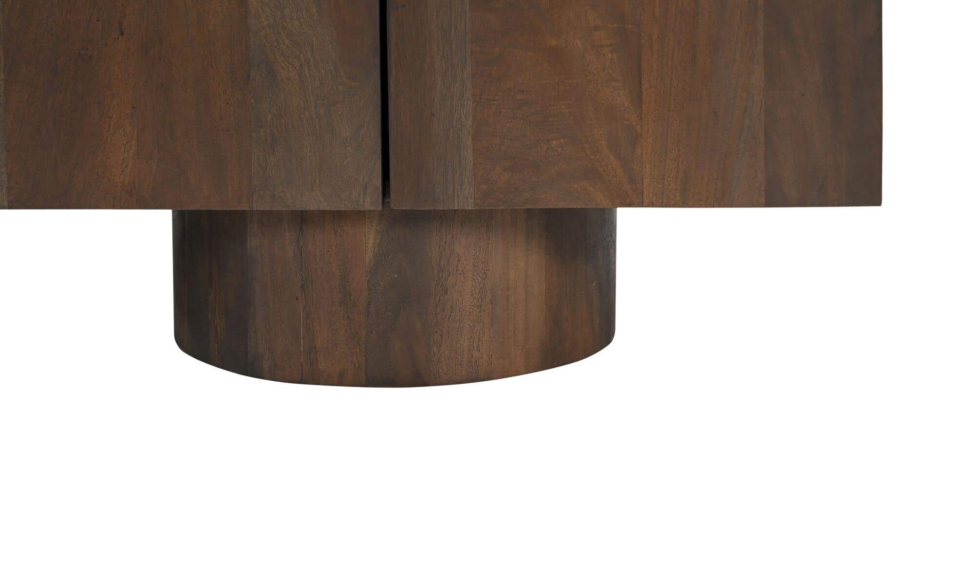 Close-up shot focusing on the high-quality wood grain and the structural joinery of the unique cylindrical plinth support