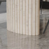 Macro shot focusing on the vertical wood slats and geometric texture of the fluted cylindrical table support