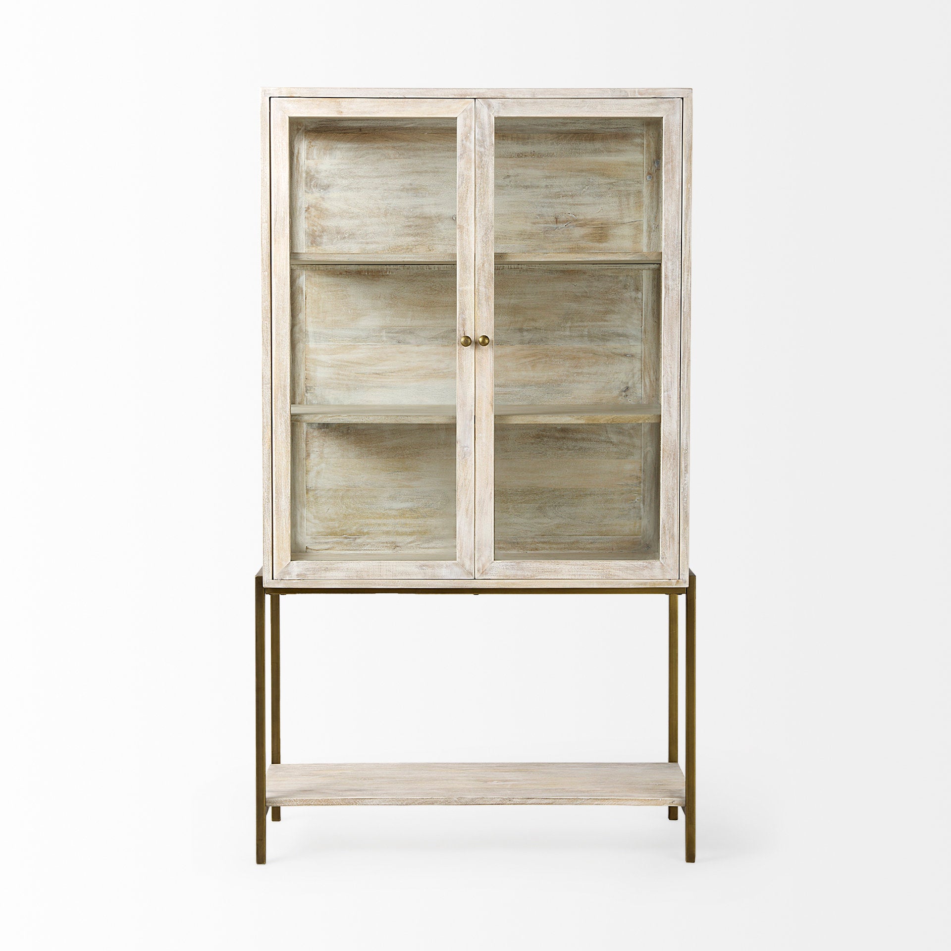 Front view of the Arelius display cabinet featuring white-washed wood, glass double doors, and a slim gold-finished metal base with a lower shelf