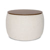 Front view of the Ash round storage ottoman featuring cream bouclé upholstery and a dark wood circular lid