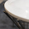 Side view close-up focusing on the thick marble slab and its secure attachment to the gold pedestal frame