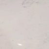 Macro shot focusing on the soft grey natural veining and polished finish of the authentic white marble surface