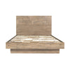 Front view of the Atlantis platform bed featuring a tall headboard with a unique patchwork wood inlay and light driftwood finish