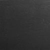 Close-up of black wood frame detail on Auden accent chair