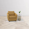 The caramel Baltimo chair styled in a bright showroom setting with a white side table