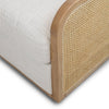 Close-up shot of the smooth, rounded solid oak armrest and the texture of the Prestige Natural fabric.