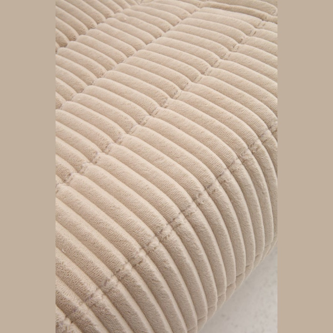 Large front view of the Rigo accent chair in beige corduroy fabric with a low-profile channeled design.