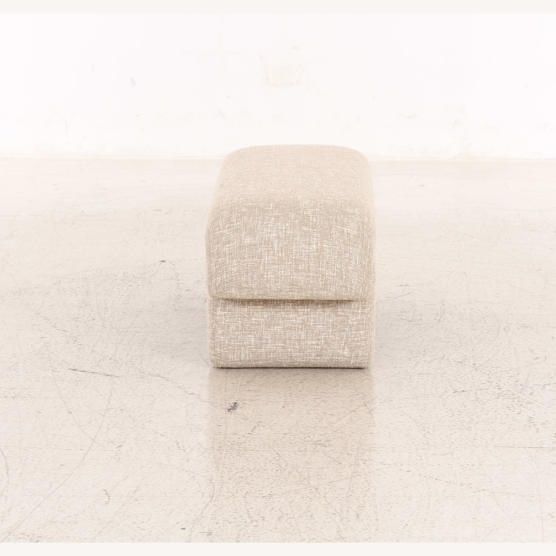 Berger upholstered bench in cream textured fabric with unique sculpted pedestal base