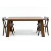 Studio lifestyle shot featuring the walnut Bessa table paired with two black upholstered contemporary chairs