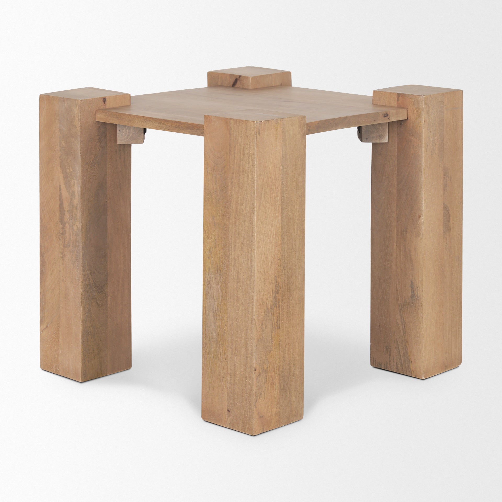 Perspective shot showcasing the clean lines and solid structural joinery where the thick square legs meet the tabletop