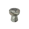 Perspective shot focusing on the balanced geometric proportions and the earthy multi-tonal green and brown stone finish