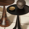 Close-up lifestyle shot of the black Polina table top used to display a textured contemporary ceramic vase