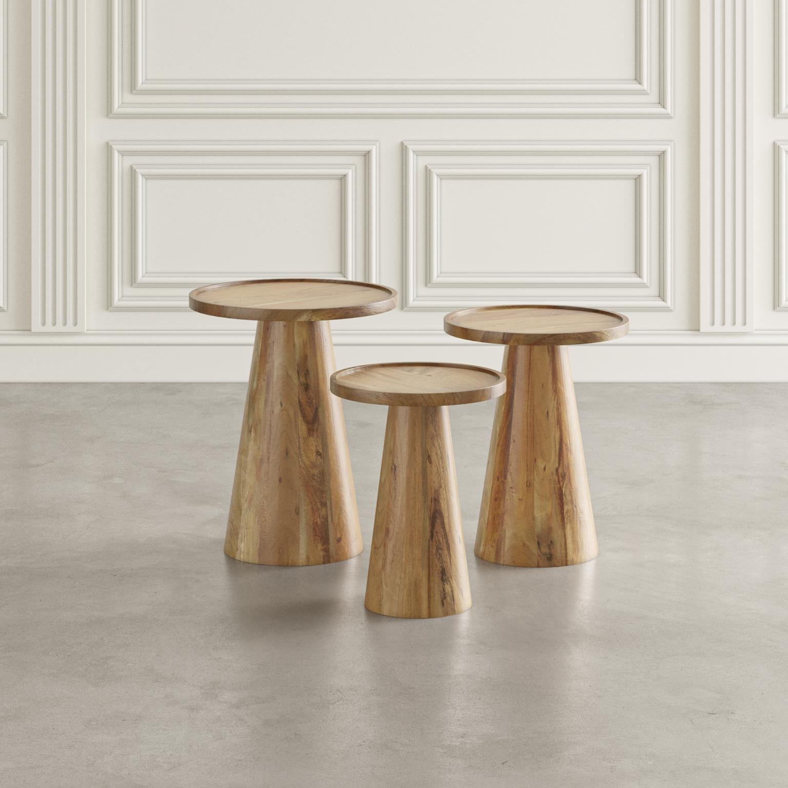 Perspective lifestyle view of the bunching tables in a bright room showcasing their clean lines and architectural silhouette