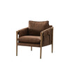 Angled view of Bodil tan leather accent chair with minimalist Scandinavian frame