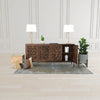 Wide-angle lifestyle shot featuring the sideboard styled as a statement storage piece in a bright minimalist room