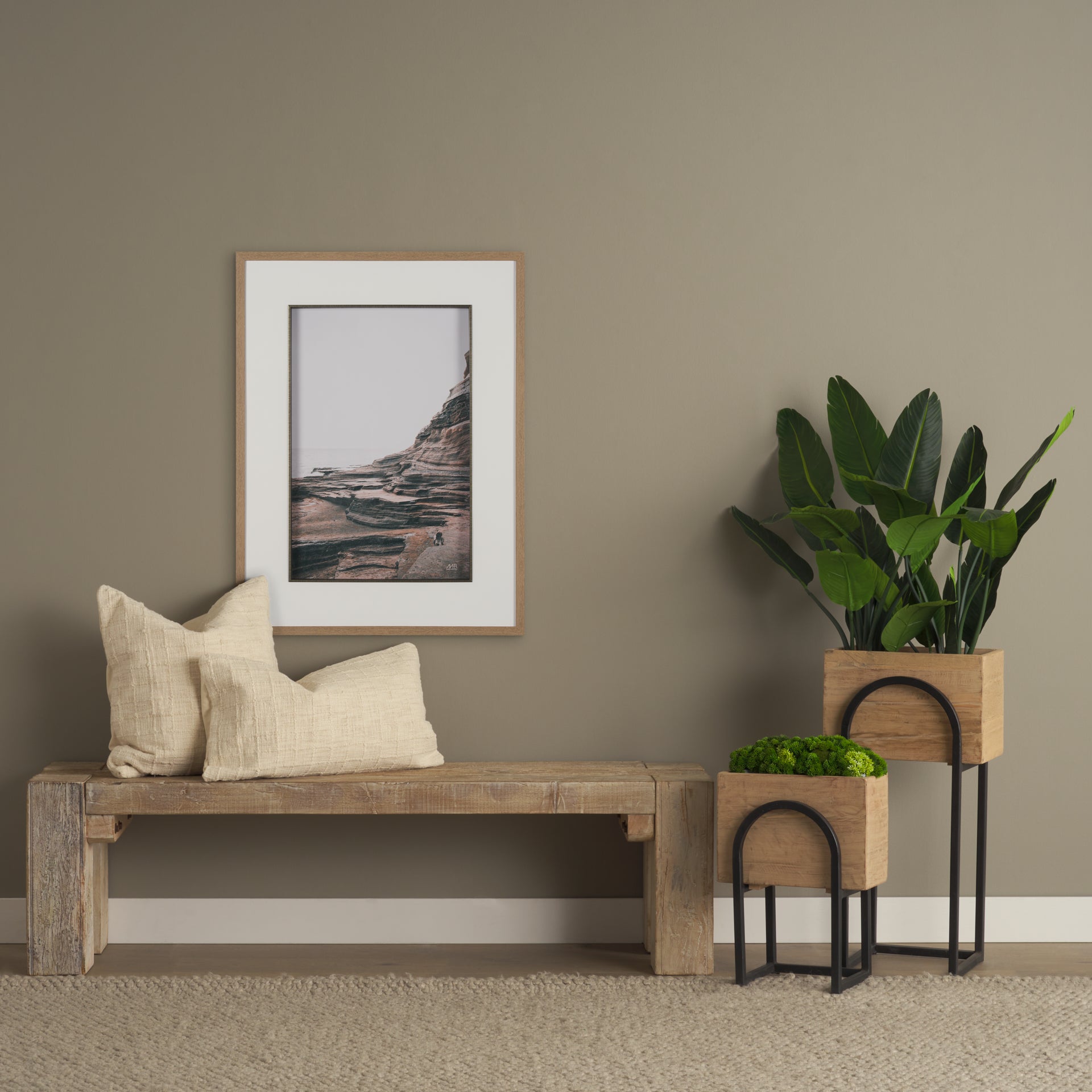 Lifestyle shot featuring the unit styled with indoor plants and textured pillows in a warm boho-inspired entryway