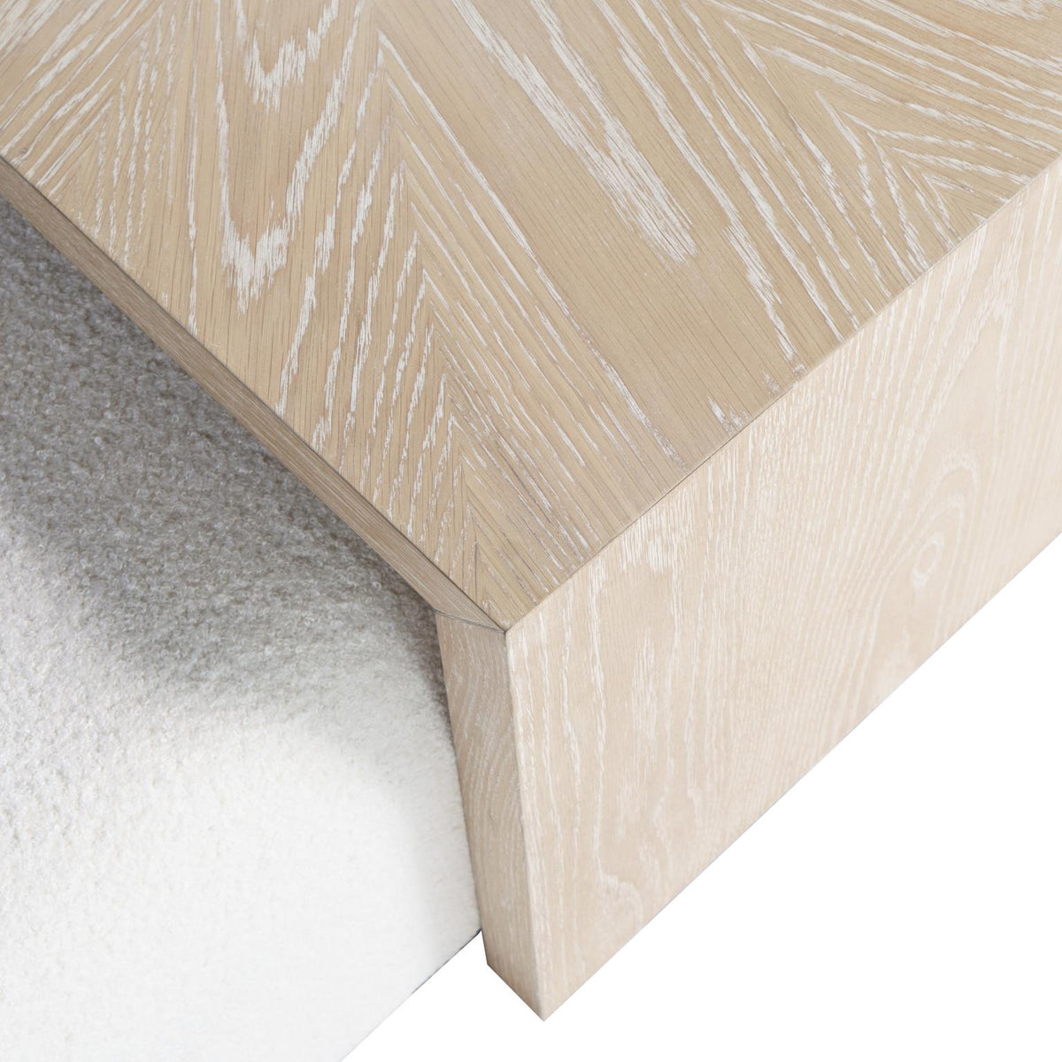 Close-up macro shot highlighting the natural light ash wood grain and smooth finish of the sliding cocktail table top