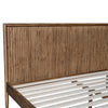 Close-up view of the tapered wood leg providing a stable and visually light foundation for the frame