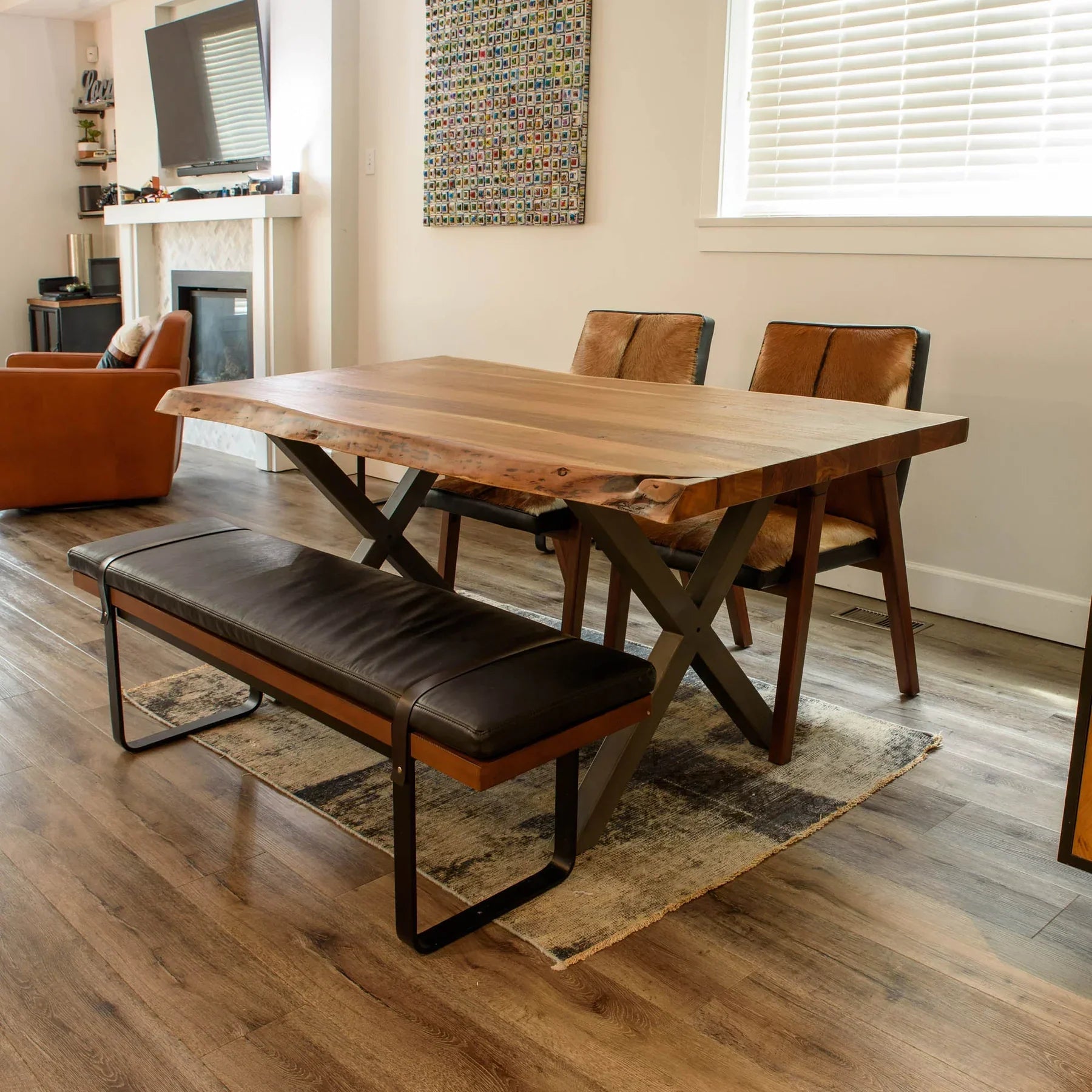 Front view of the Brooklyn upholstered bench featuring a dark leather-style seat, natural wood frame, and black metal sled legs