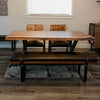 Perspective view of the Brooklyn bench in a sunlit dining area highlighting the natural wood grain