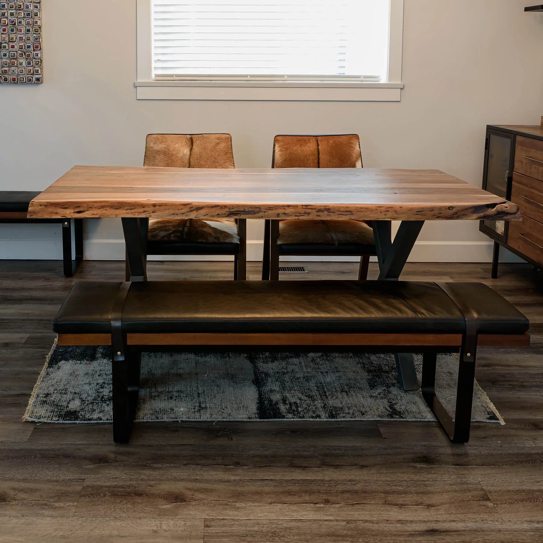 Front view of the Brooklyn upholstered bench featuring a dark leather-style seat, natural wood frame, and black metal sled legs