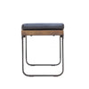 Side profile view emphasizing the minimalist black metal sled leg design and slim wood frame