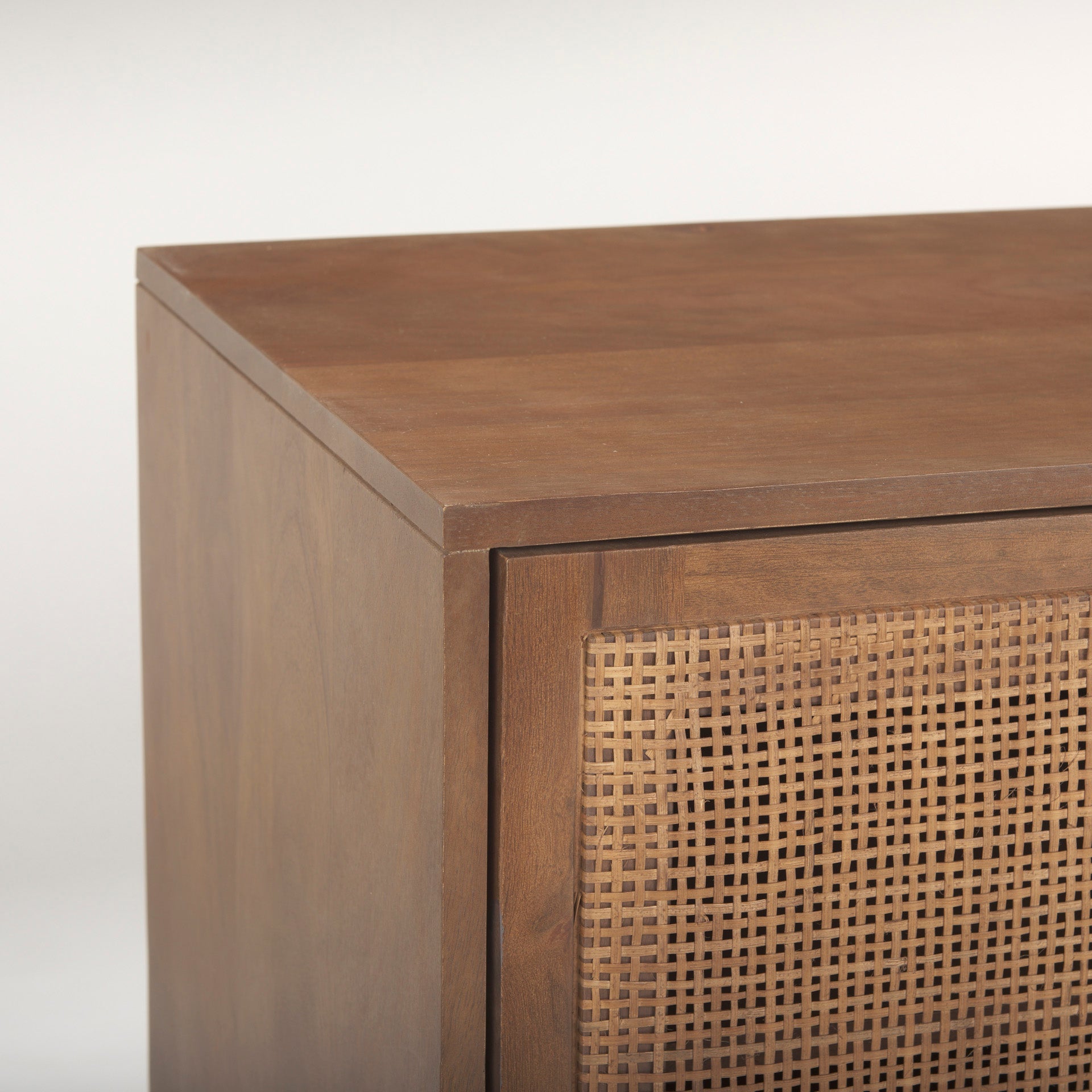 Detailed view of the internal hardware and precise corner construction of the medium brown wood doors