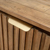 Macro shot focusing on the contemporary gold linear door pulls integrated into the textured vertical slat wood panels
