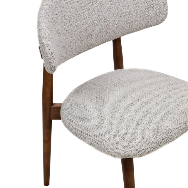 Cammy dining chair with beige textured fabric upholstery and walnut wood legs, front view on white background