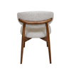 Back view of Cammy dining chair with beige textured fabric upholstery and solid walnut wood support frame