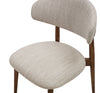 Close-up detail of Cammy dining chair seat and backrest with beige textured fabric upholstery and walnut wood frame