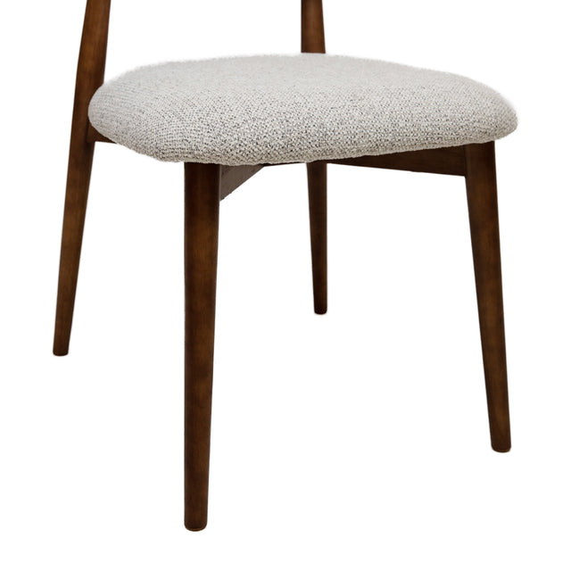 Cammy dining chair with beige textured fabric upholstery and walnut wood legs, front view on white background
