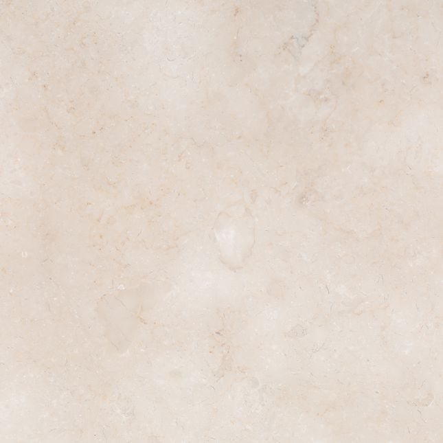 Macro detail view of the cream travertine tabletop showcasing its organic stone texture and subtle natural variations