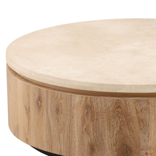 Three-quarter perspective highlighting the thick travertine surface and the smooth natural wood grain of the circular drum base