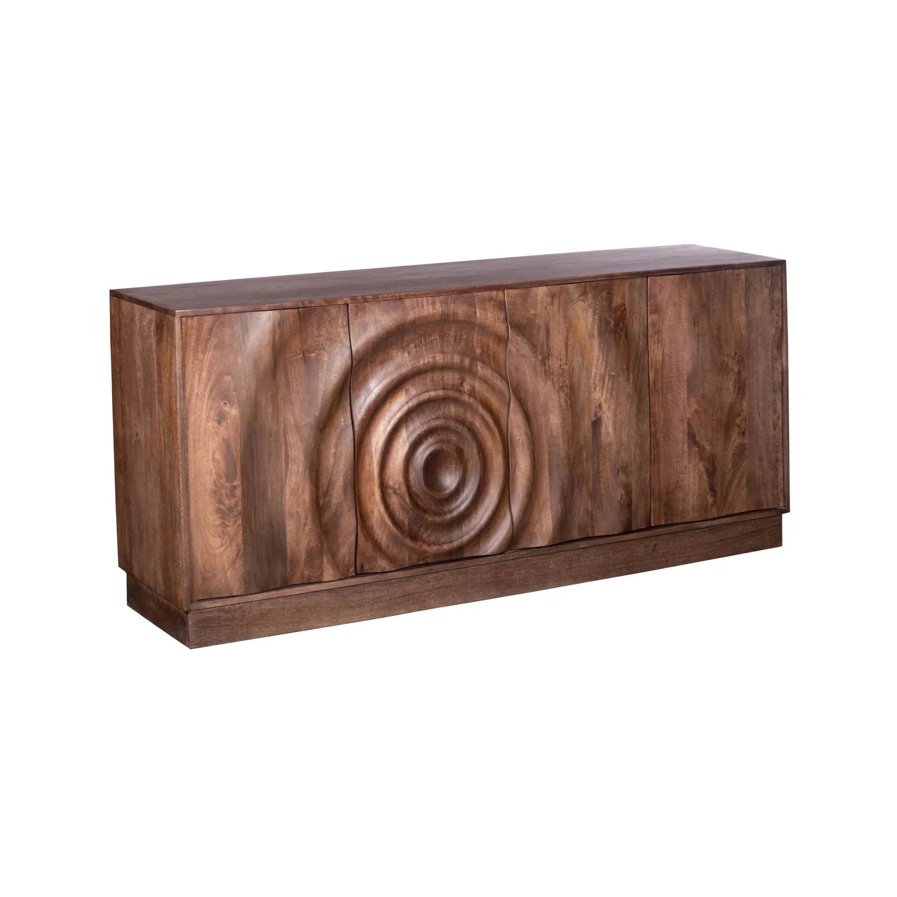 Three-quarter perspective view of the Caracol sideboard featuring a rich natural mango wood finish and a large hand-carved concentric circle design across four doors