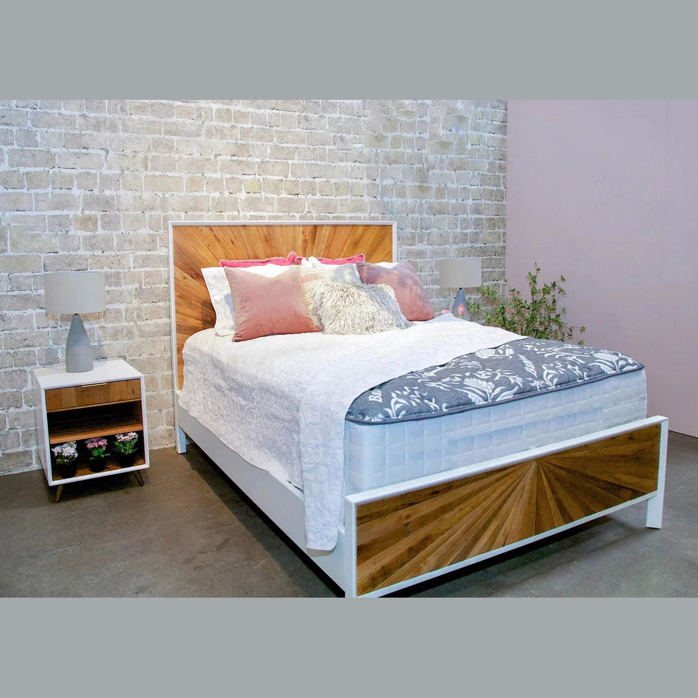 Front view of the Casablanca platform bed featuring a striking natural wood sunburst inlay on the headboard and footboard